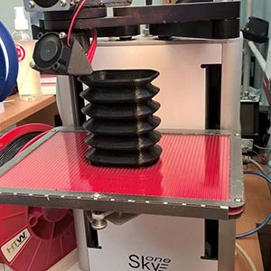 3D printed rubber protective corrugation for a linear guide